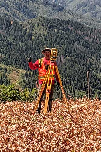 Surveyor with tripod